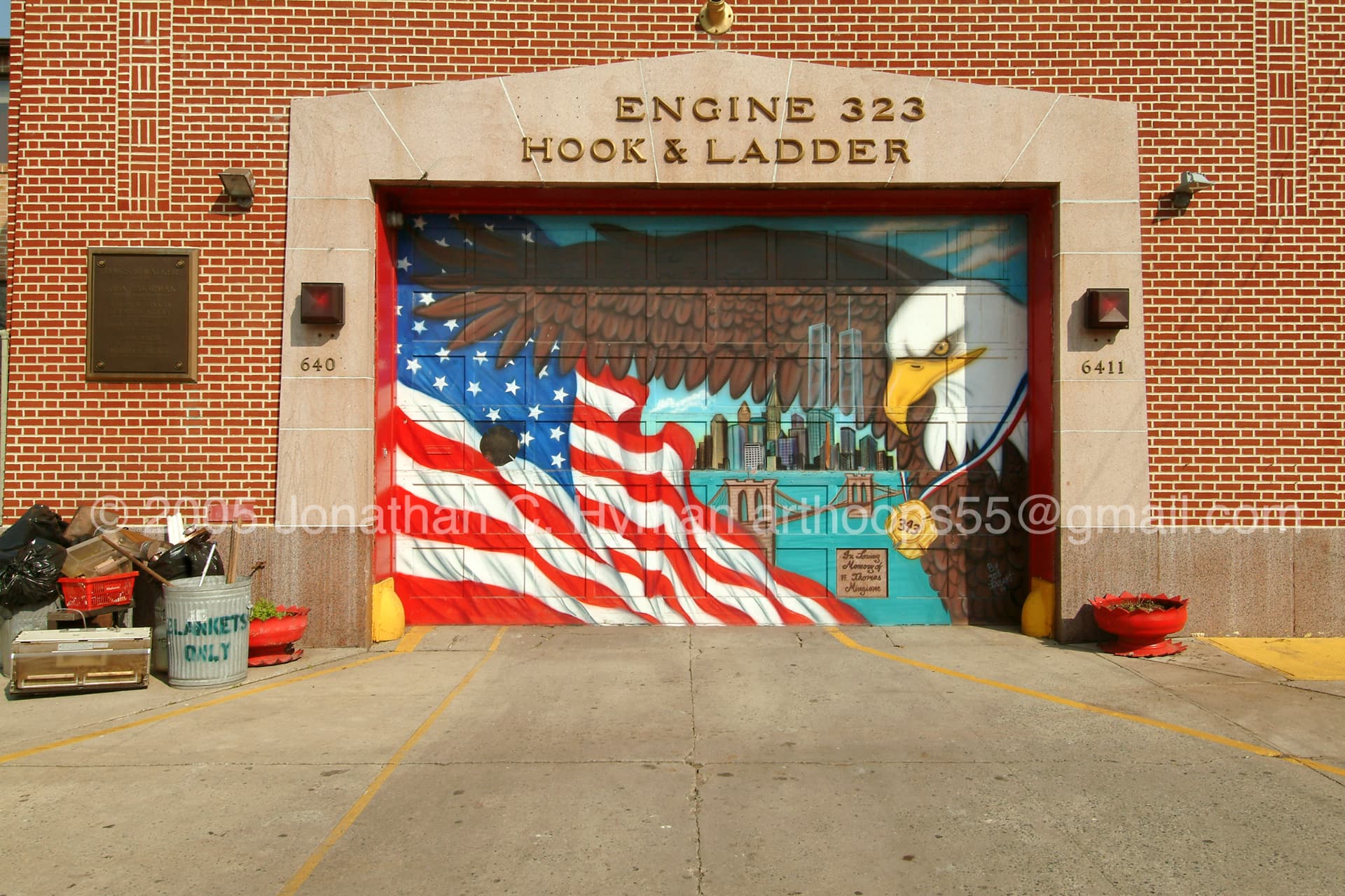 Firehouse door employs classic 9/11-related iconography as identified by photographer, Jonathan C. Hyman: Flag, Eagle, Towers