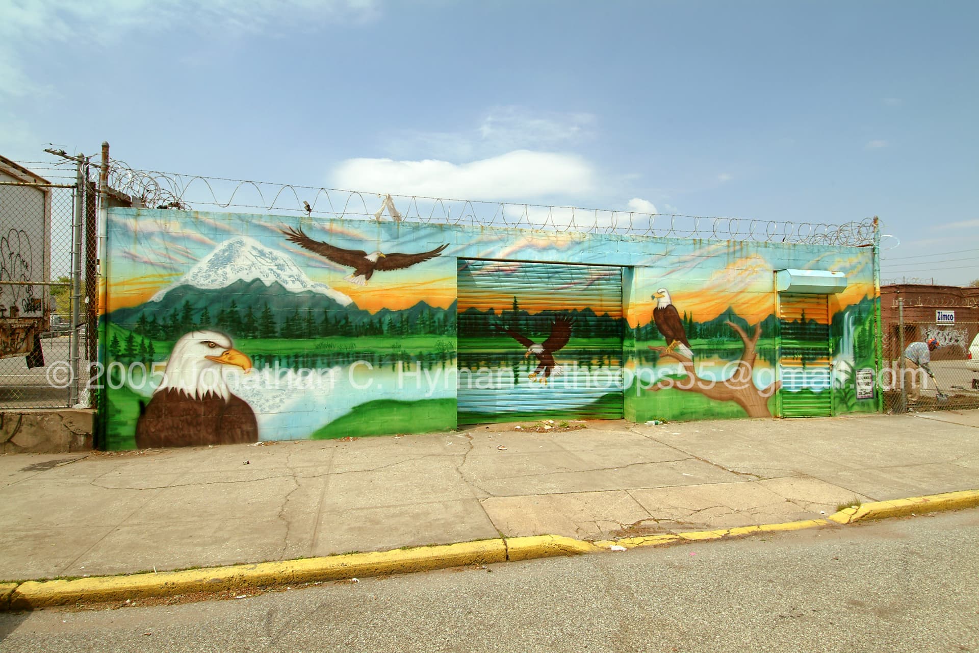 Mural of soaring eagles above mountains and a lake